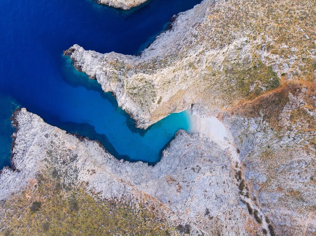 Turquoise bay and secluded beach at Seitan Limania, offering a perfect stop for boat tourists in Crete.